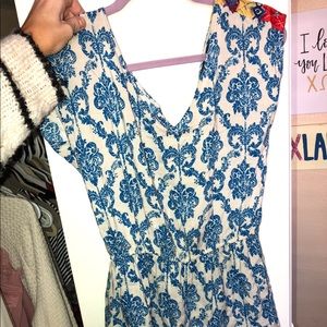 Blue floral romper with colorful trim